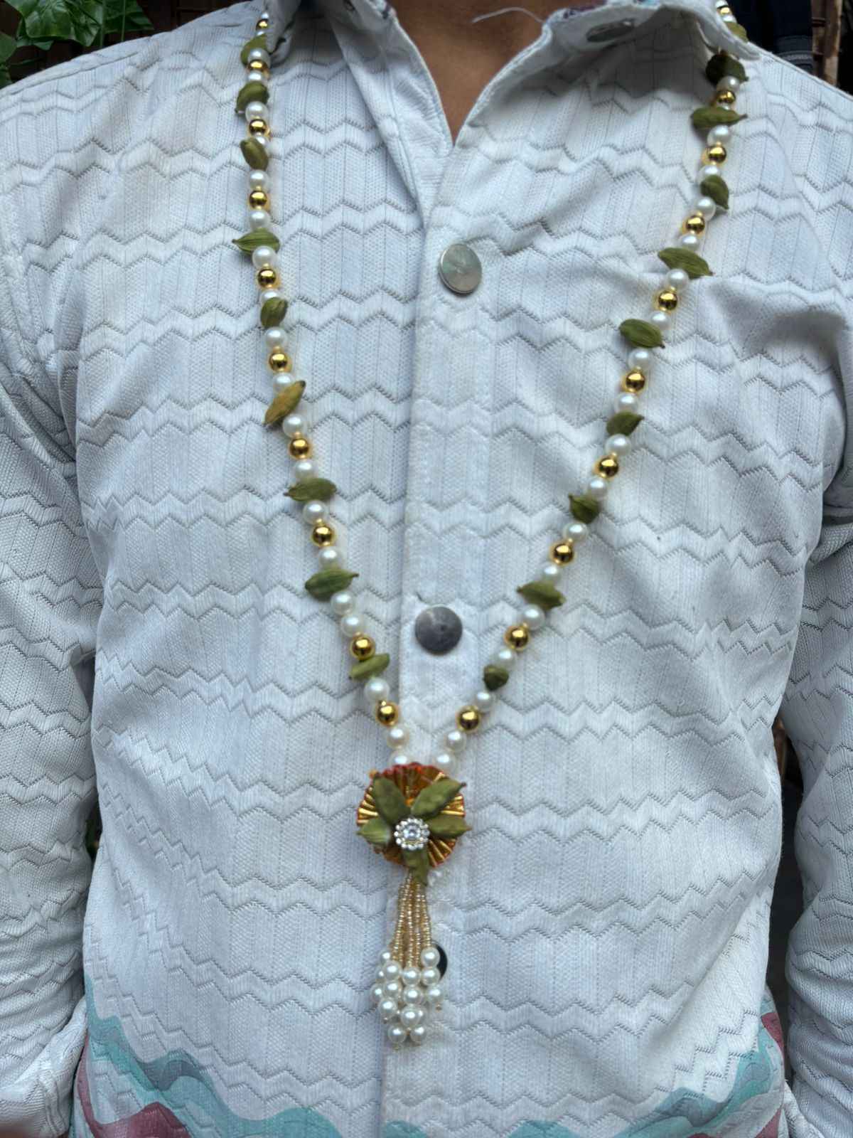 Traditional cardamom welcome garland for groom barat ceremony
