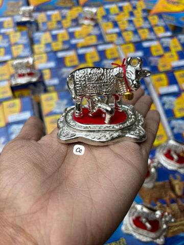 Traditional Kamdhenu cow and calf idol placed for pooja and Diwali decoration