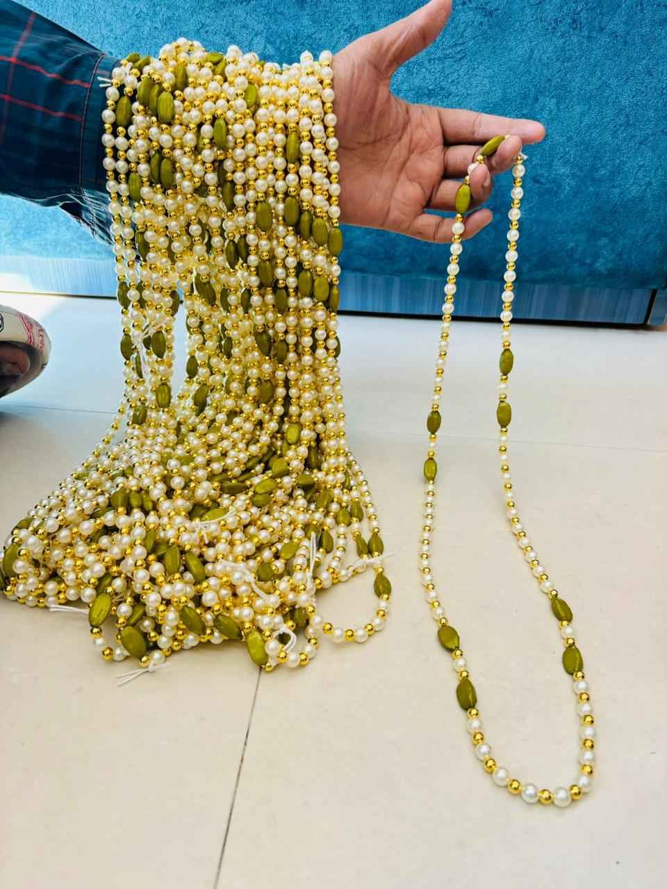 Traditional elichi mala for groom welcome