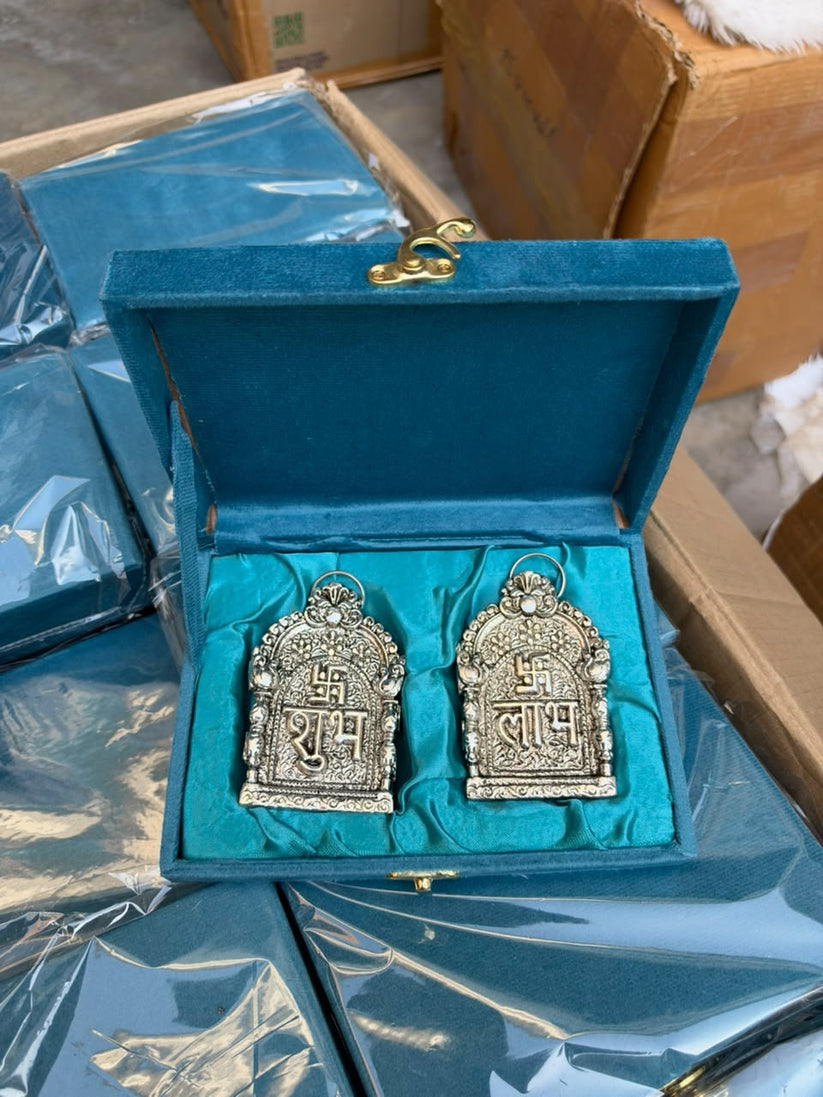 German silver Shubh Labh wall hanging pair presented in a luxury velvet gift box for Diwali home decoration and festive gifting.