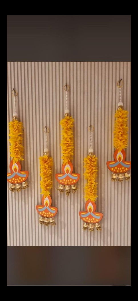 Yellow floral design hanging used for home, wedding, and festive decoration