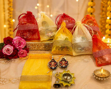 Brass Lotus Diya Bell and Ganesh Hanging Potli Hamper for Festive Gifting