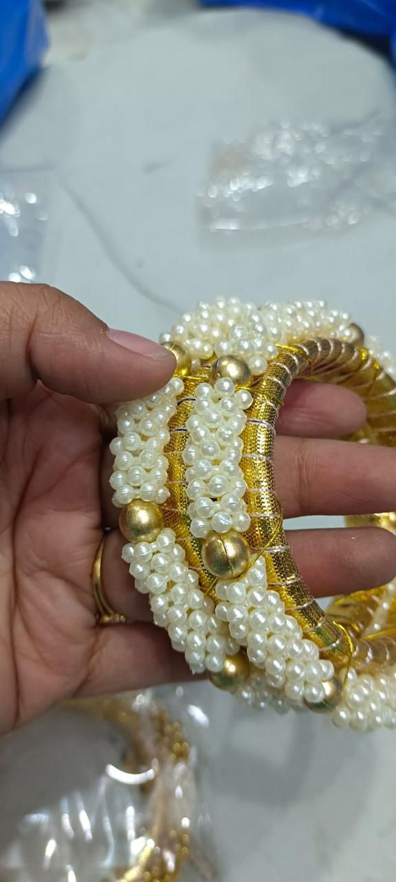 Designer multi layer heavy pearl bracelet for women for wedding and festive wear