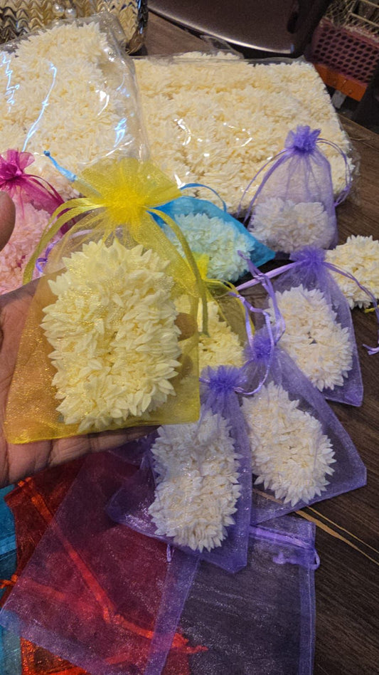 Traditional gajra arranged in decorative hamper for wedding and festive gifting