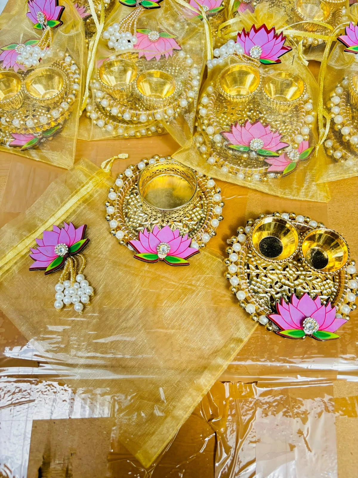 Lotus T-light holder and Roli Chawal platter in decorative potli