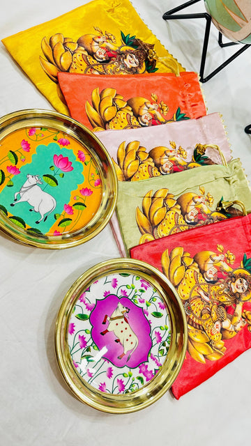Pichwai print decorative platter with matching potli bag for wedding, pooja, and festive gifting